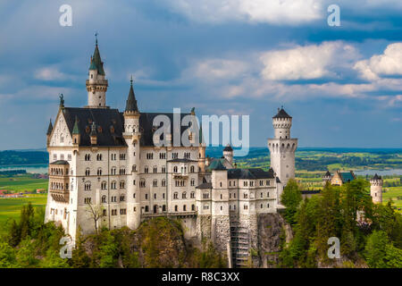 Nice close view of the southern side of the famous Neuschwanstein Castle, a Romanesque Revival palace on a rugged hill above the village of... Stock Photo