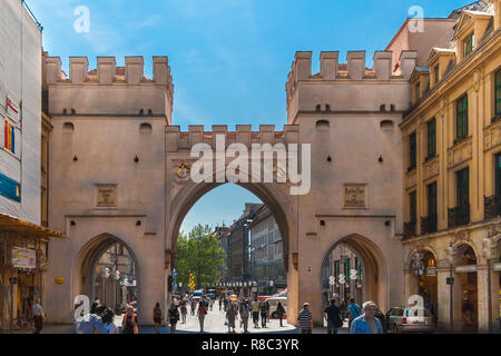 Munich, Germany - MAY 2008: Full view of the Karlstor, known by locals as Stachus, at the pedestrian zone that is part of Munich's historic old town. Stock Photo