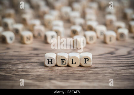 dice forming the word HELP Stock Photo