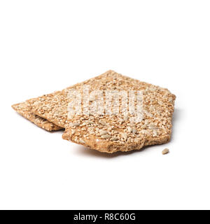 Wholemeal crisp bread with sunflower seeds on a white studio background Stock Photo