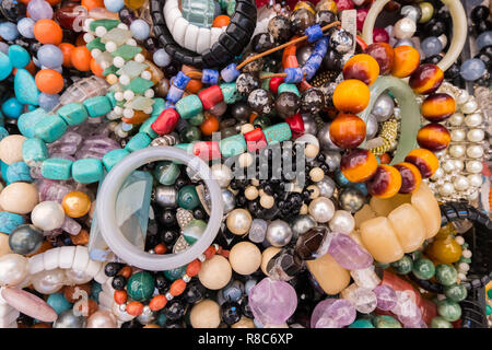 Wallpaper background of stylish bracelets made with colorful stones. Fake  jewelery Stock Photo - Alamy