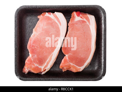 Raw pork loin chops in plastic tray isolated on white background. Stock Photo