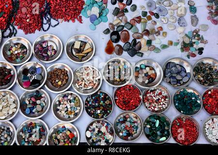 Rows of colorful polished gemstones used for jewelry making in Jaipur, Rajasthan, India. Stock Photo