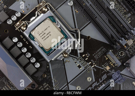 Maykop, Russia - November 9, 2018: intel core I3 desktop processor 8th gen on the motherboard Asus closeup top view Stock Photo