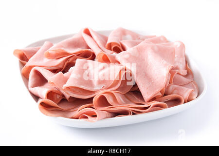 Mortadella slices on white plate isolated on white background. Close up Stock Photo