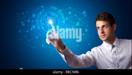 Man touching hologram screen displaying keys and locks Stock Photo