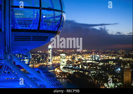 (Selective focus) Beautiful view from the top of the ferris wheel (London Eye) with the river Thames and the illuminated city of London. Stock Photo