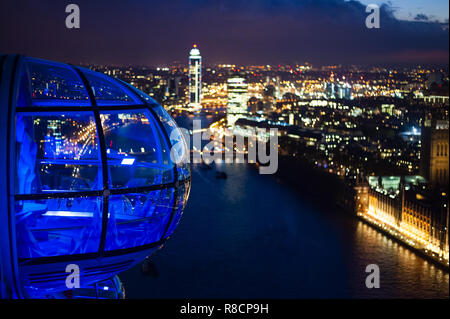 (Selective focus) Beautiful view from the top of the ferris wheel (London Eye) with the river Thames and the illuminated city of London. Stock Photo