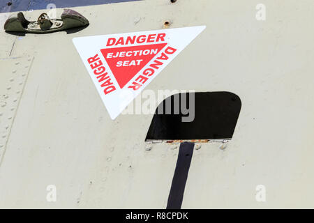 Danger Ejection Seat sign on an old jet plane Stock Photo