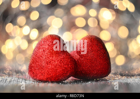 The red Heart shapes on abstract light glitter background in love concept for valentines day Stock Photo
