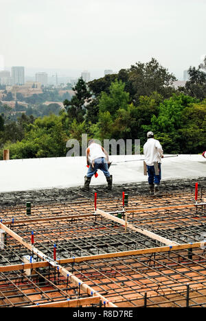 Pouring concrete on a new raised deck Stock Photo