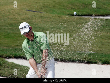 Louis Oosthuizen of South Africa hits out of the sand on hole 18 during round one of the World Golf Championships - CA Championship at Doral Country Club in Doral, Florida on March 12, 2009. Stock Photo