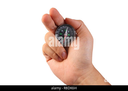 Photo image of a hand holding compass isolated on white with empty space Stock Photo
