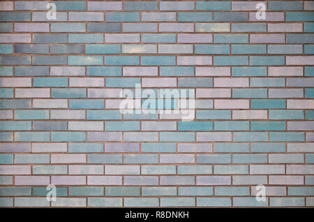 The texture of wall from a variety of old and dirty brick. Detailed pattern of a plurality of different sizes of brick colored worn out Stock Photo