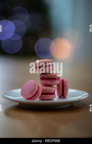 Macaron tower infront of a christmas tree Stock Photo