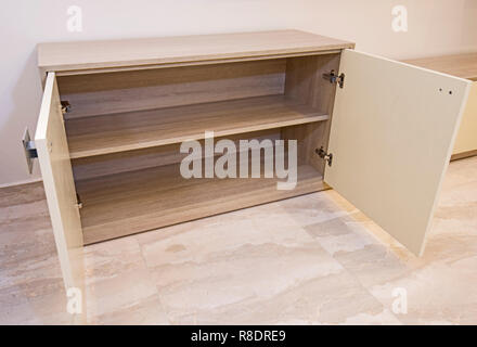 Living room cupboard in luxury apartment show home showing interior design decor furnishing Stock Photo