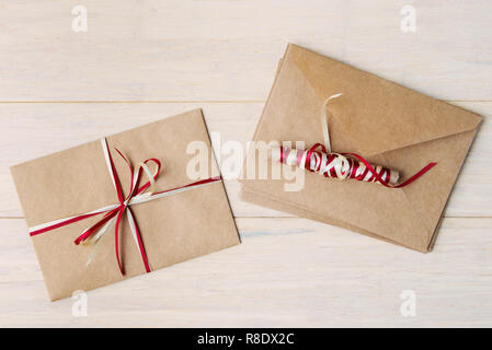Craft envelopes  on wooden background Stock Photo