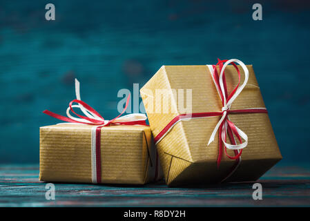 Close up of two gift boxes over blue wooden background Stock Photo