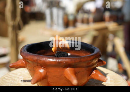 Oil lamps are lighting fixtures that are fueled with oils Stock Photo