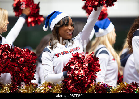 Houston, Texas, USA - November 22, 2018 The H-E-B Thanksgiving Day Parade, Cheerleaders from the Texans NFL Football Team, on a float during the parad Stock Photo