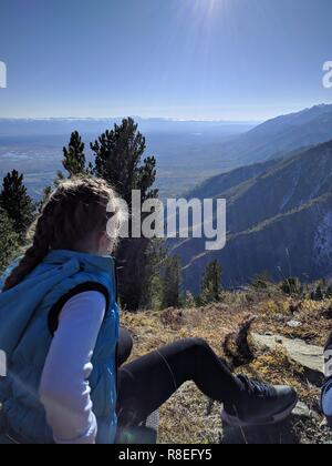 Family members are taking pictures of each other. Photos from the phone during the hike. Family travels. People environment by mountains, rivers, stre Stock Photo