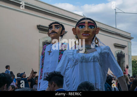 Giant male and female wedding puppets mimicking a bride and groom, on ...