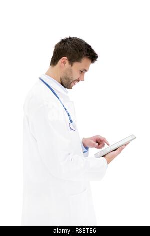 Young male doctor using digital tablet. Stock Photo