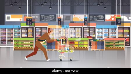 running business man customer with shopping trolley cart busy male shopper buying products grocery market interior flat horizontal Stock Vector