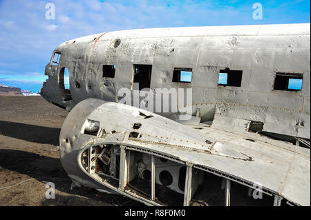 Twisted wreckage of abandoned US military plane sits on Solheimasandur black sand beach, near Vik, Southern Iceland Stock Photo
