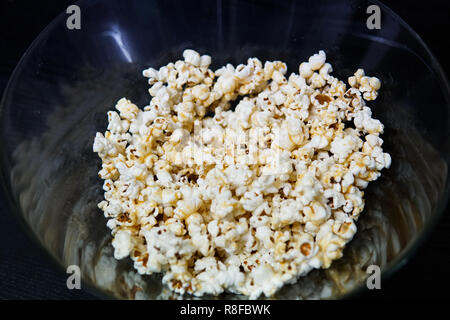 Fresh popcorn in a transparent bowl Stock Photo