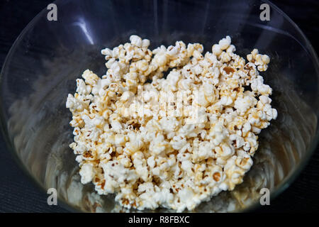 Fresh popcorn in a transparent bowl Stock Photo
