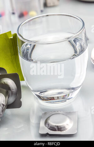 effervescent tablets and glass with water, conceptual image Stock Photo