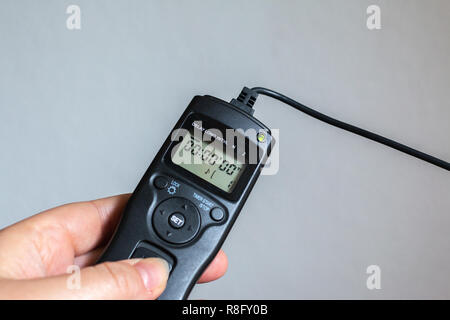close up of a hand holding a remote trigger Stock Photo