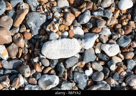Chalk and flint pebbles on a beach Stock Photo
