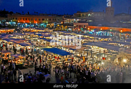 STREET MARKET, JEMAA-EL FNAS, MARRAKECH, MOROCCO. MAY 2011. Medina Old City in the centre of Marrakech in Morocco on an early evening with crowds gath Stock Photo