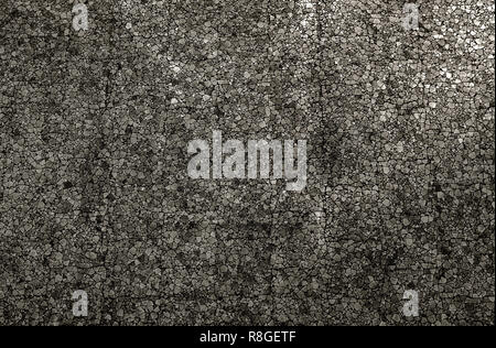 Closeup of a Grey colored mosaic Stone Wall usable as decorative Background, Surface or Texture. Stock Photo