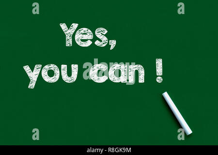 Chalk drawing - 'Yes you can' written on chalkboard Stock Photo