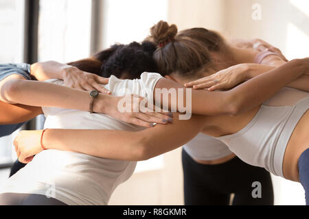 Group of women standing together embracing prepare for competiti Stock Photo