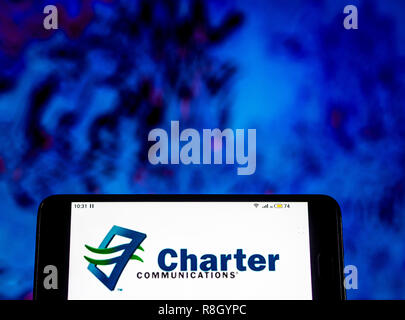 Charter Communications Telecommunications company  logo seen displayed on smart phone. Stock Photo