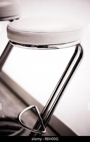 bar or office round chairs close-up with shallow depth of field in the foreground Stock Photo