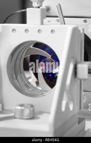 Red laser on optical table in physics laboratory, solid-state laser installation in physical laboratory Stock Photo