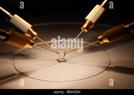manufacture of chips on a printed circuit board under a microscope Stock Photo