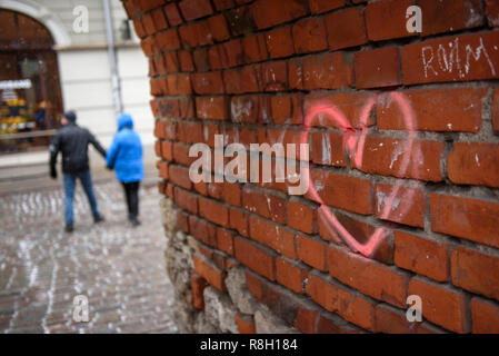24.11.2018. RIGA, LATVIA. Pink heart symbol painted as scrawl on wall. Stock Photo