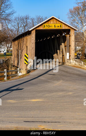 Lancaster, PA, USA - December 13, 2018:  Bitzer’s Mill Covered Bridge spans the Conestoga River in Lancaster County, PA. It is the oldest bridge in th Stock Photo