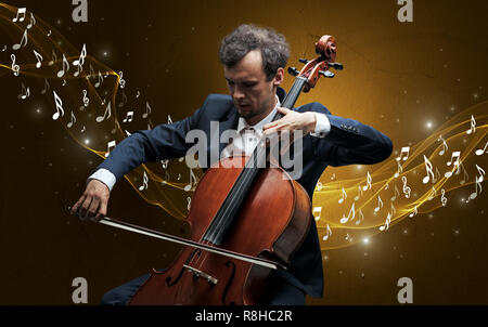 Lonely musical composer with cello and sparkling musical notes around Stock Photo