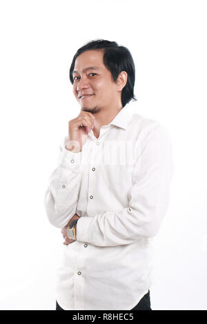 Photo image portrait of a funny young successful and confident Asian businessman looked very happy and smiling, half body close up portrait Stock Photo