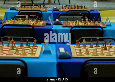 Chess pieces lined up across many boards in readiness for a big tournament Stock Photo
