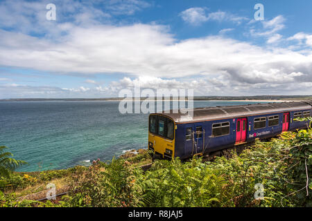 Pretty branch line coastal rail journey between St.Erth and St.ives Cornwall UK Europe Stock Photo