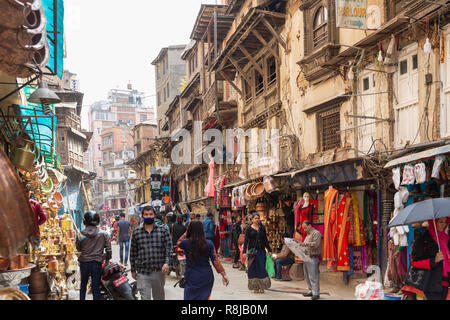 People walking through crowded shopping area street in Thamel District in Kathmandu, Nepal Stock Photo