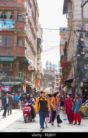 People walking through urban shopping area in Kathmandu, Nepal Stock Photo